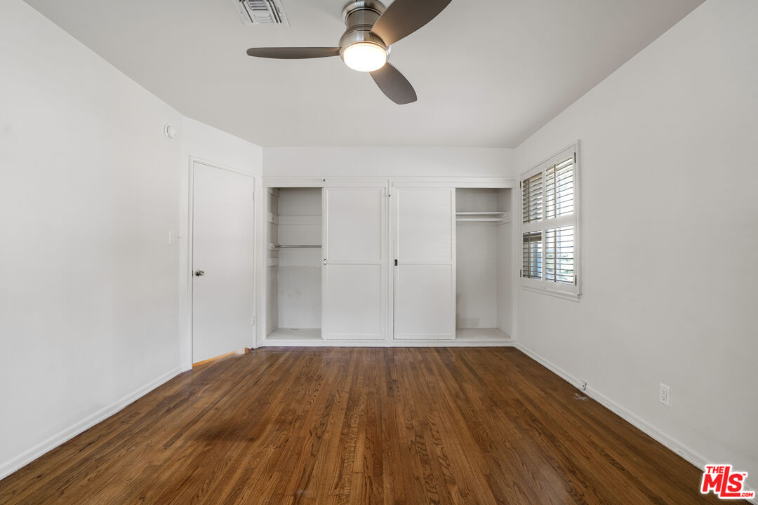 1617 Reeves Street Los Angeles, CA 90035 - Photo 33 of 55 a view of empty room with wooden floor and fan