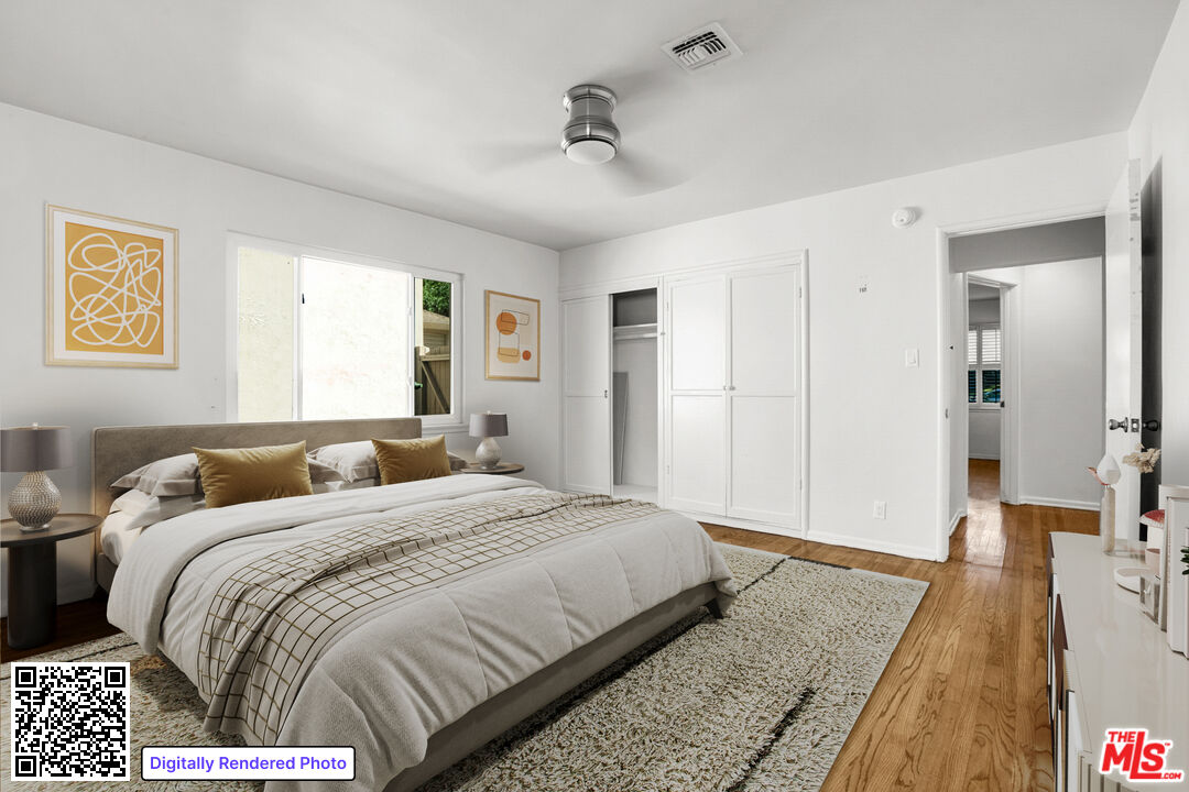 1617 Reeves Street Los Angeles, CA 90035 - Photo 38 of 55 a bedroom with a bed and wooden floor