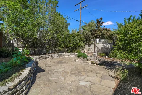 an aerial view of a house with outdoor space