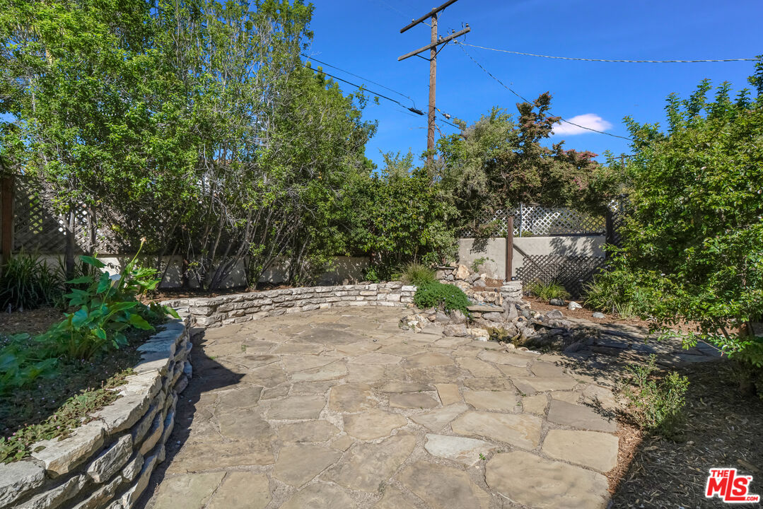 1617 Reeves Street Los Angeles, CA 90035 - Photo 43 of 55 a backyard of a house with lots of green space