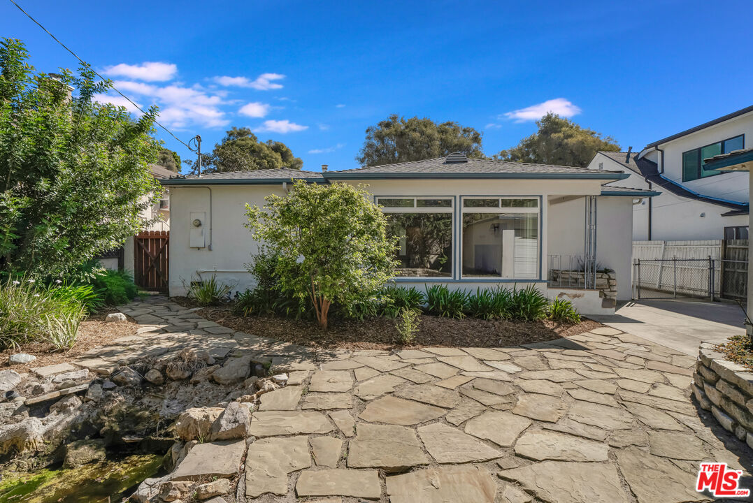 1617 Reeves Street Los Angeles, CA 90035 - Photo 44 of 55 a front view of a house with a yard