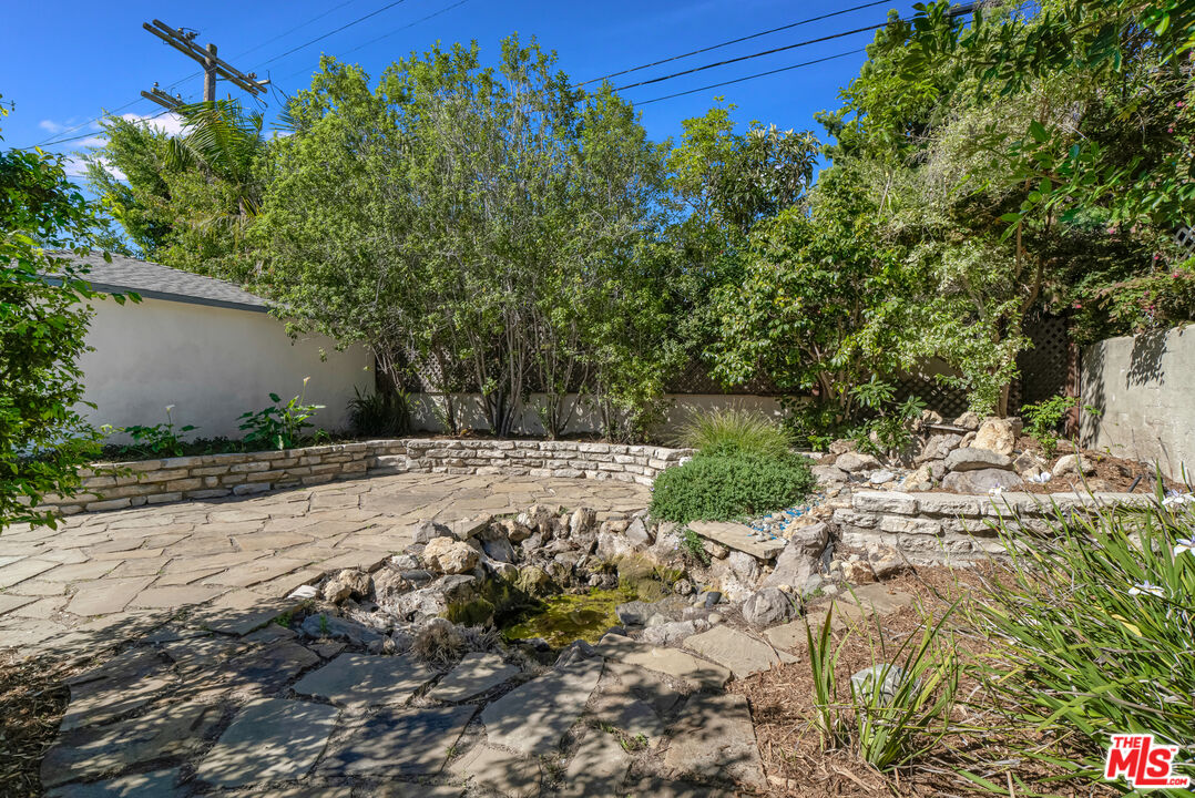 1617 Reeves Street Los Angeles, CA 90035 - Photo 46 of 55 a view of a yard with plants and tree