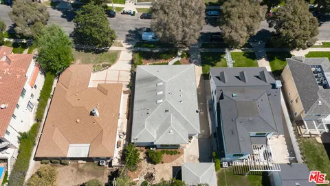 a view of swimming pool and trees in the background