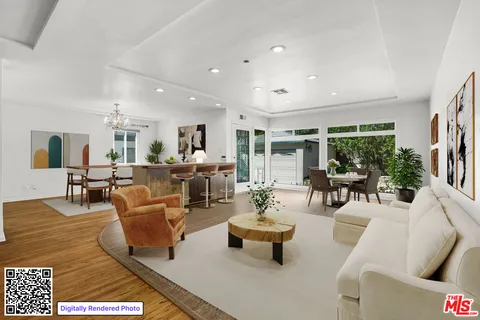 a living room with furniture kitchen view and a large window
