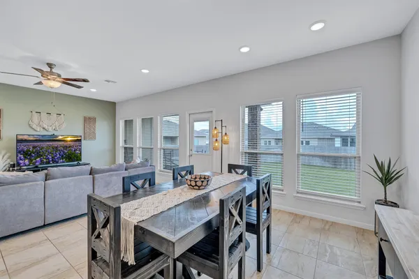 a view of a dining room with furniture window and outside view