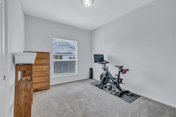 a view of room with furniture and a window