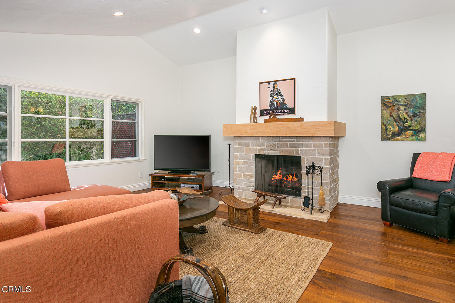 625 Burleigh Drive Pasadena, CA 91105 - Photo 16 of 43 a living room with furniture a fireplace and a flat screen tv