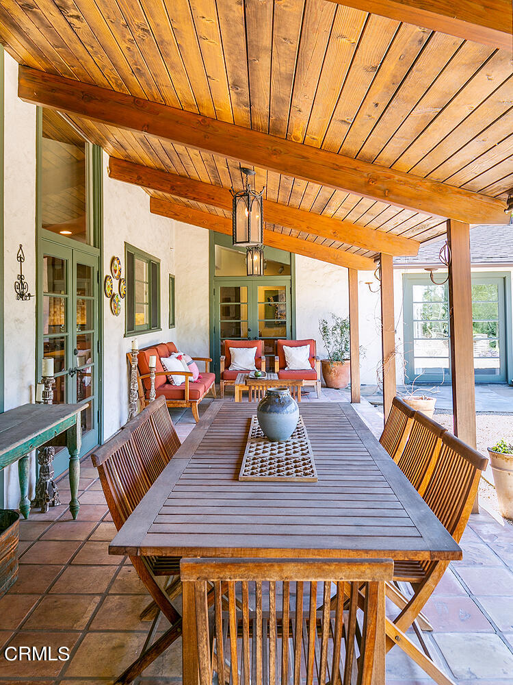 625 Burleigh Drive Pasadena, CA 91105 - Photo 37 of 43 a view of a dining room with furniture large windows and wooden floor