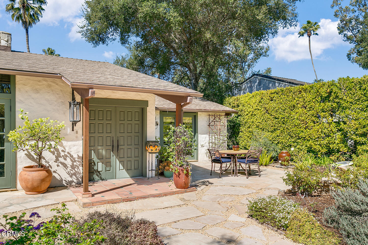 625 Burleigh Drive Pasadena, CA 91105 - Photo 5 of 43 a view of a patio with table and chairs potted plants and large tree