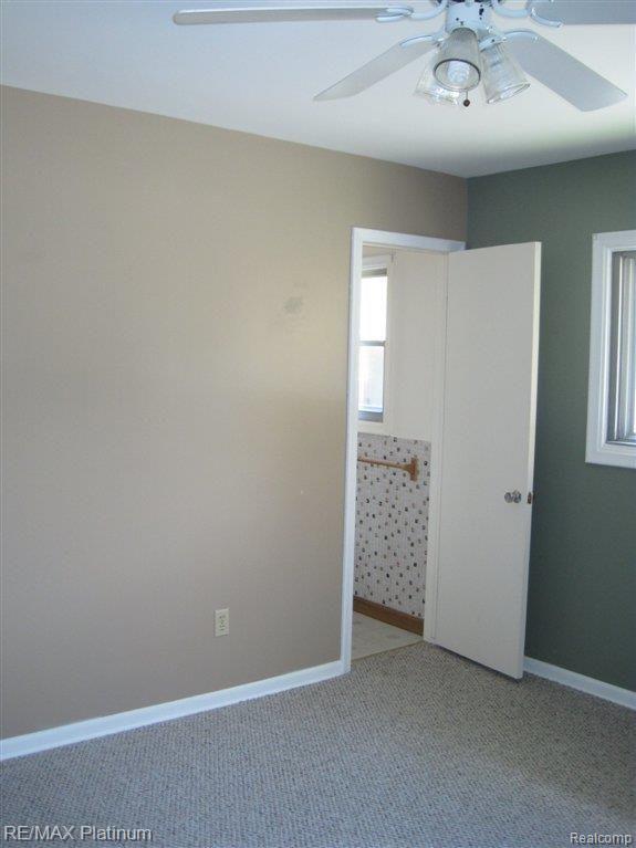 3391 Hammerberg Road Flint, MI 48507 - Photo 18 of 22 Hardwood under carpet.JPG