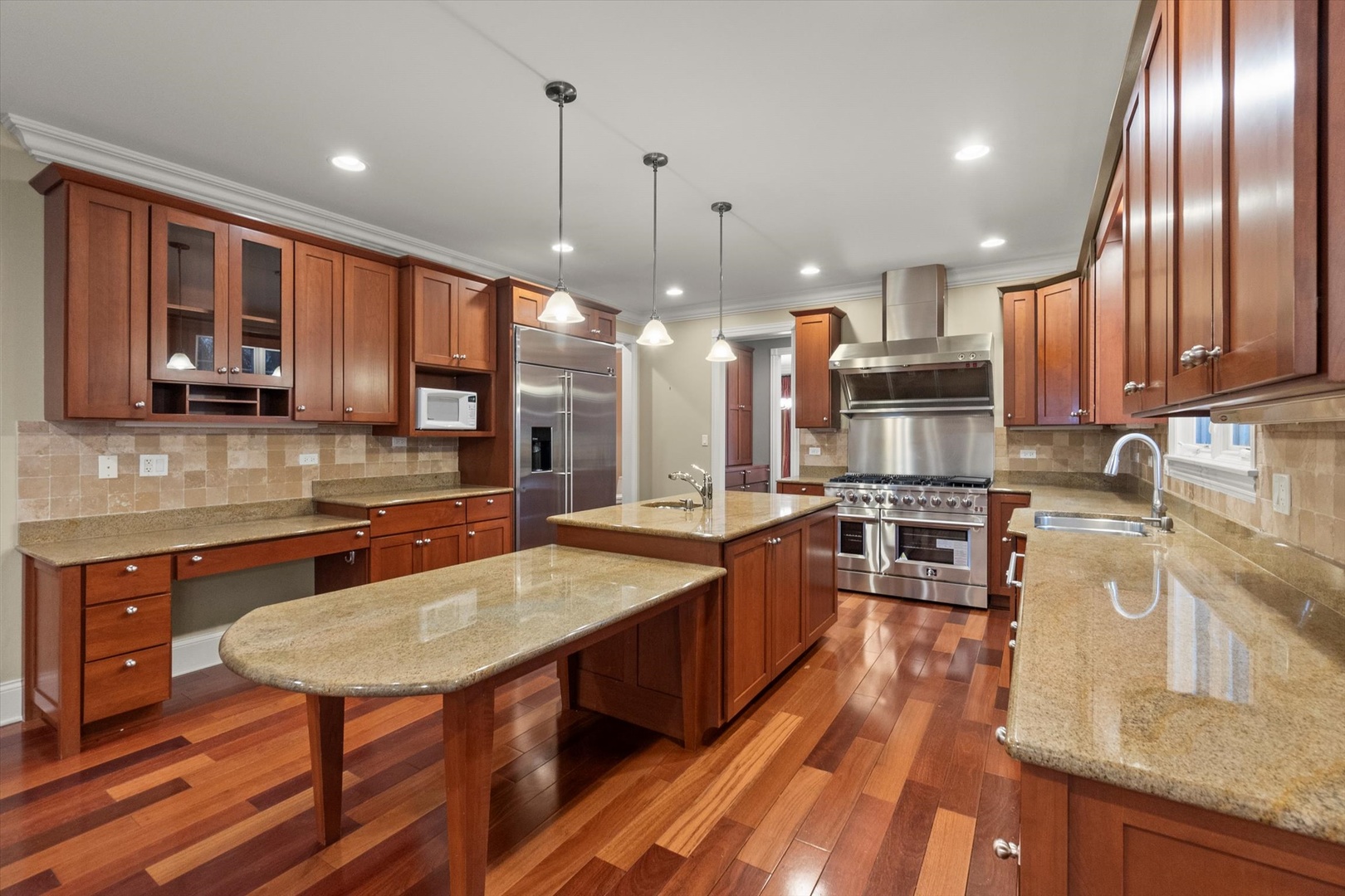 130 Fuller Road Hinsdale, IL 60521 - Photo 11 of 30 a large kitchen with lots of counter space a sink and appliances