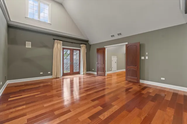 a spacious bathroom with a granite countertop tub sink shower and mirror