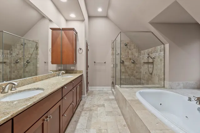 a bathroom with a bathtub and a shower