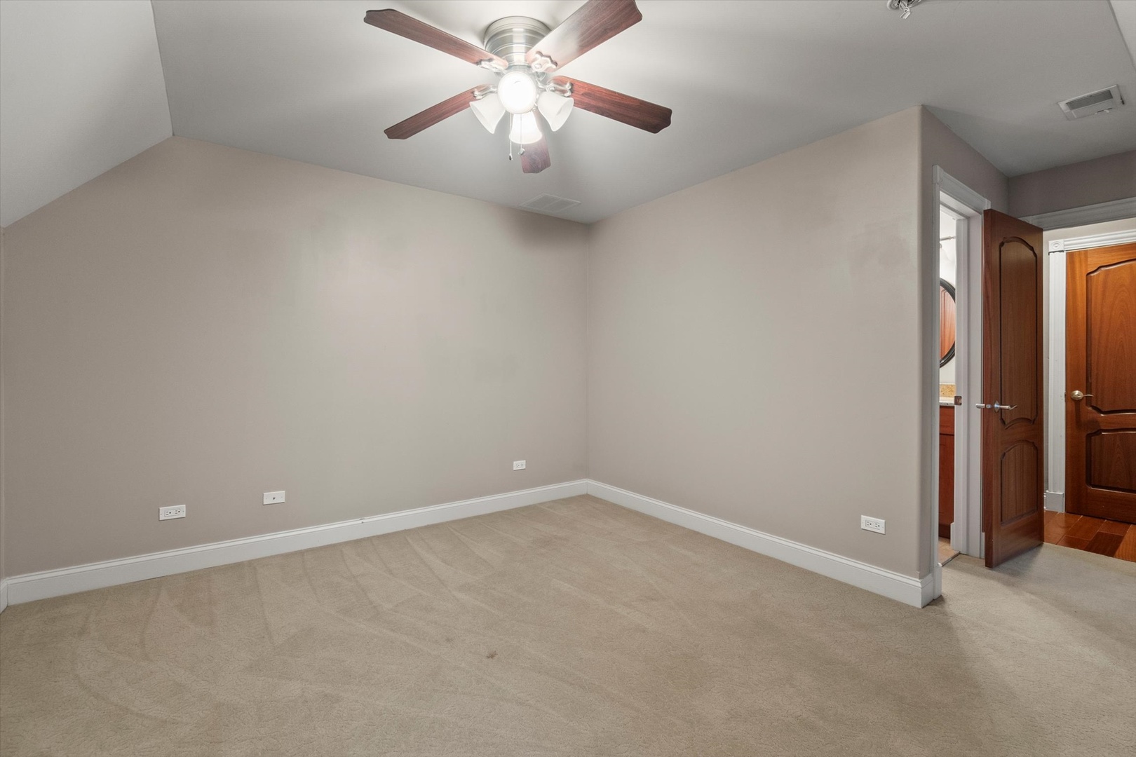 130 Fuller Road Hinsdale, IL 60521 - Photo 24 of 30 an empty room with a chandelier fan and closet