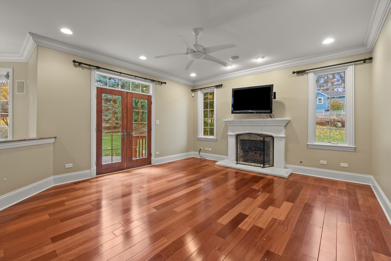 130 Fuller Road Hinsdale, IL 60521 - Photo 5 of 30 a view of an empty room with wooden floor and a window