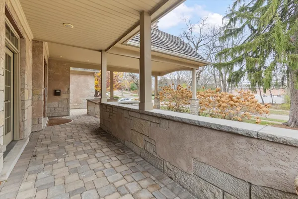 a bathroom with a bathtub and large window