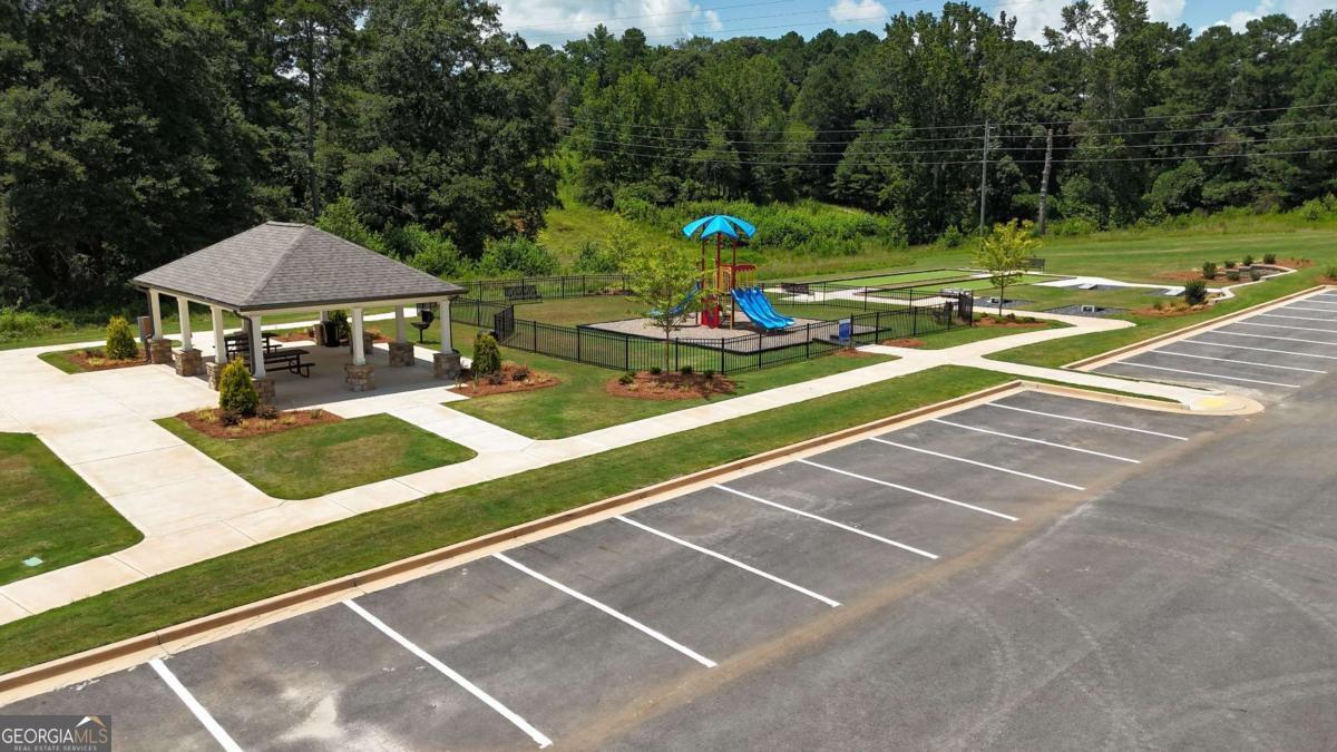 190 Otway Loop Winder, GA 30680 - Photo 16 of 17 a view of a tennis ground with large trees