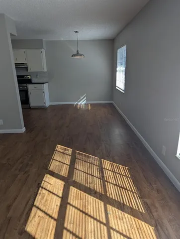 a view of wooden floor in an empty room