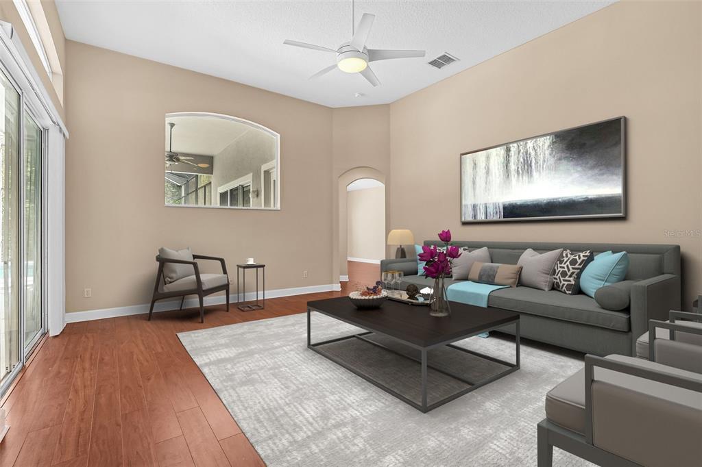 1542 Wescott Loop Winter Springs, FL 32708 - Photo 11 of 62 a living room with furniture and a hard wood floor