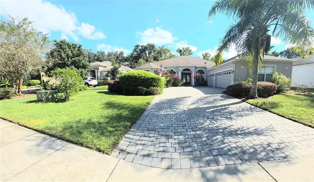 an aerial view of house with yard