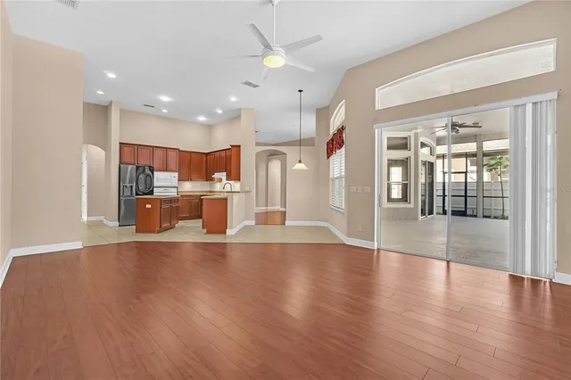 a spacious bathroom with a tub sink and mirror