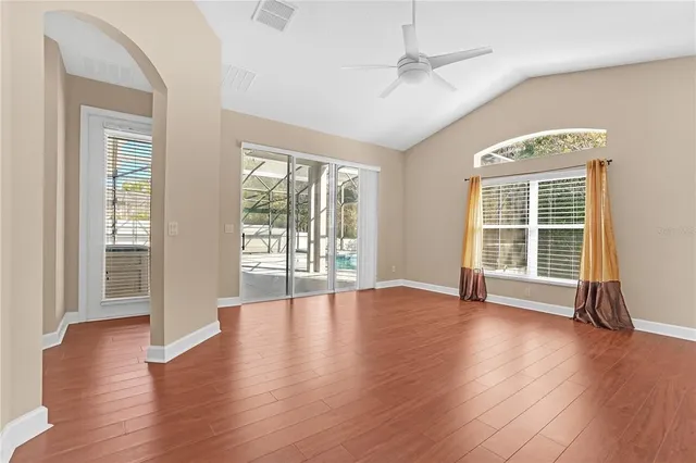 an empty room with wooden floor