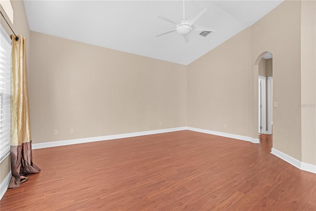 1542 Wescott Loop Winter Springs, FL 32708 - Photo 31 of 62 an empty room with wooden floor and windows