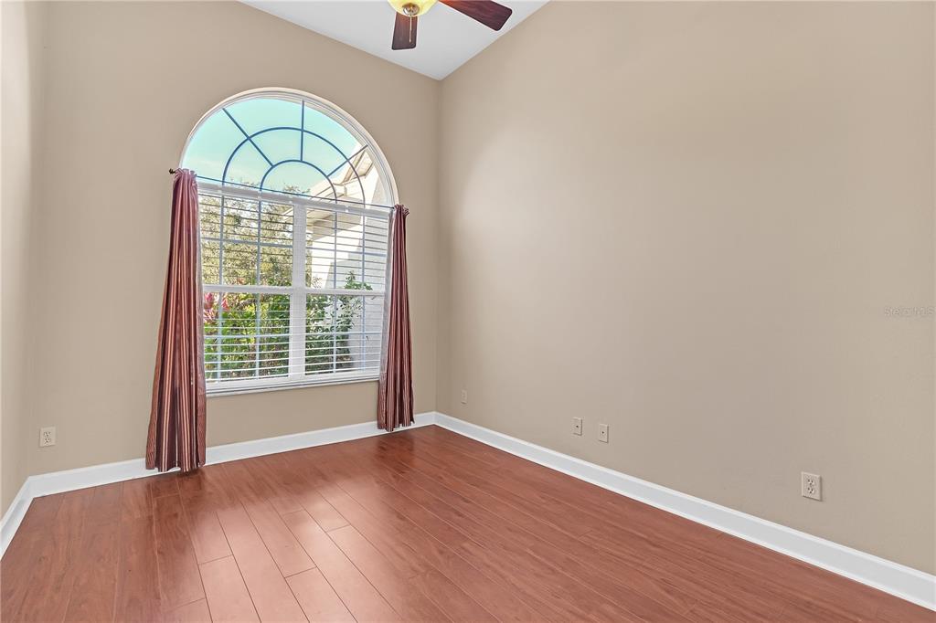 1542 Wescott Loop Winter Springs, FL 32708 - Photo 32 of 62 an empty room with wooden floor windows and a wooden floor