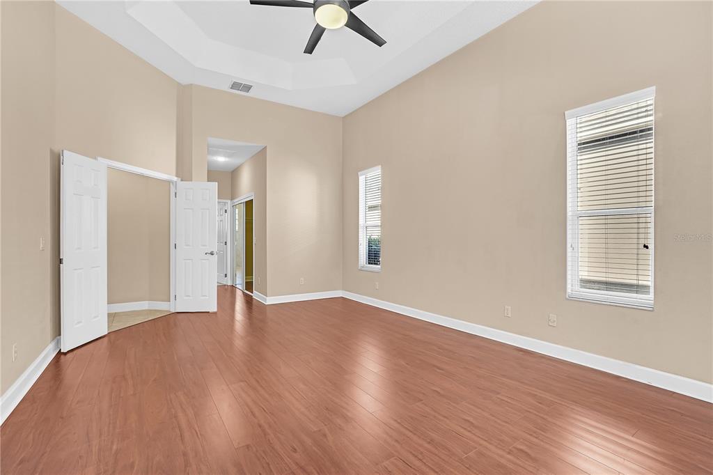 1542 Wescott Loop Winter Springs, FL 32708 - Photo 35 of 62 a view of an empty room with wooden floor and a window