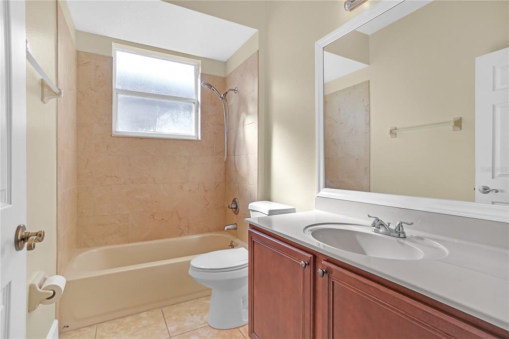 1542 Wescott Loop Winter Springs, FL 32708 - Photo 43 of 62 a bathroom with a sink a toilet and shower