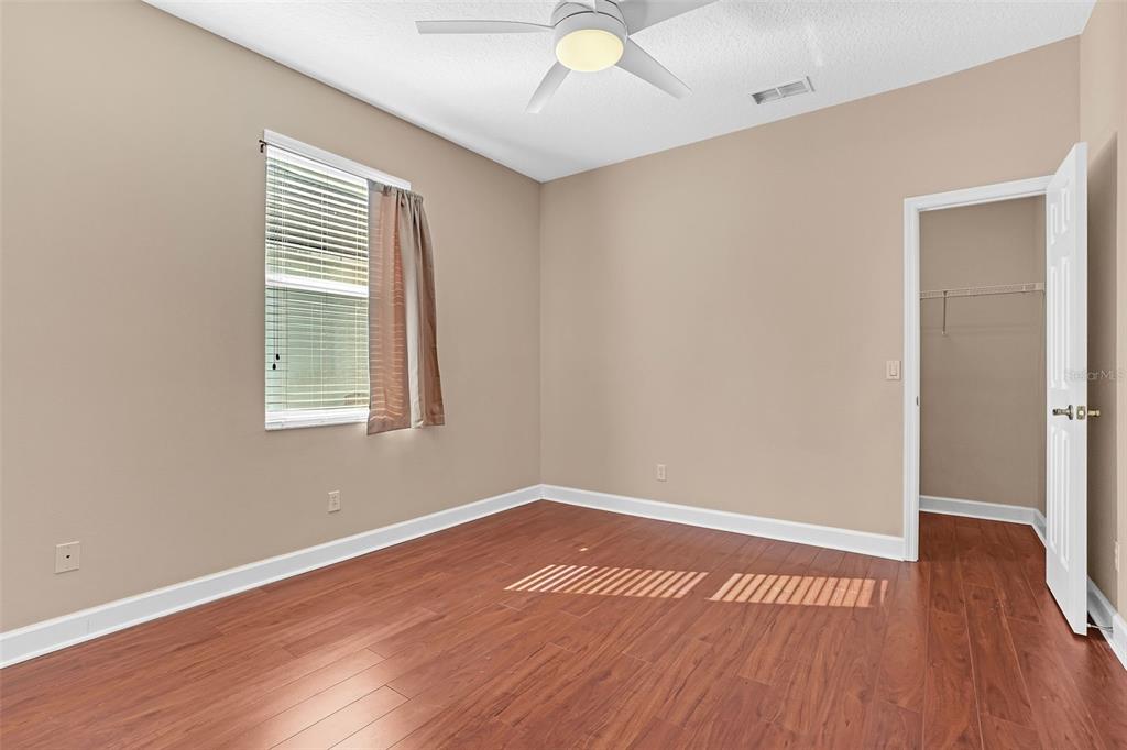 1542 Wescott Loop Winter Springs, FL 32708 - Photo 54 of 62 an empty room with wooden floor and windows