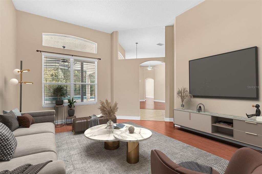 1542 Wescott Loop Winter Springs, FL 32708 - Photo 9 of 62 a living room with furniture and a flat screen tv