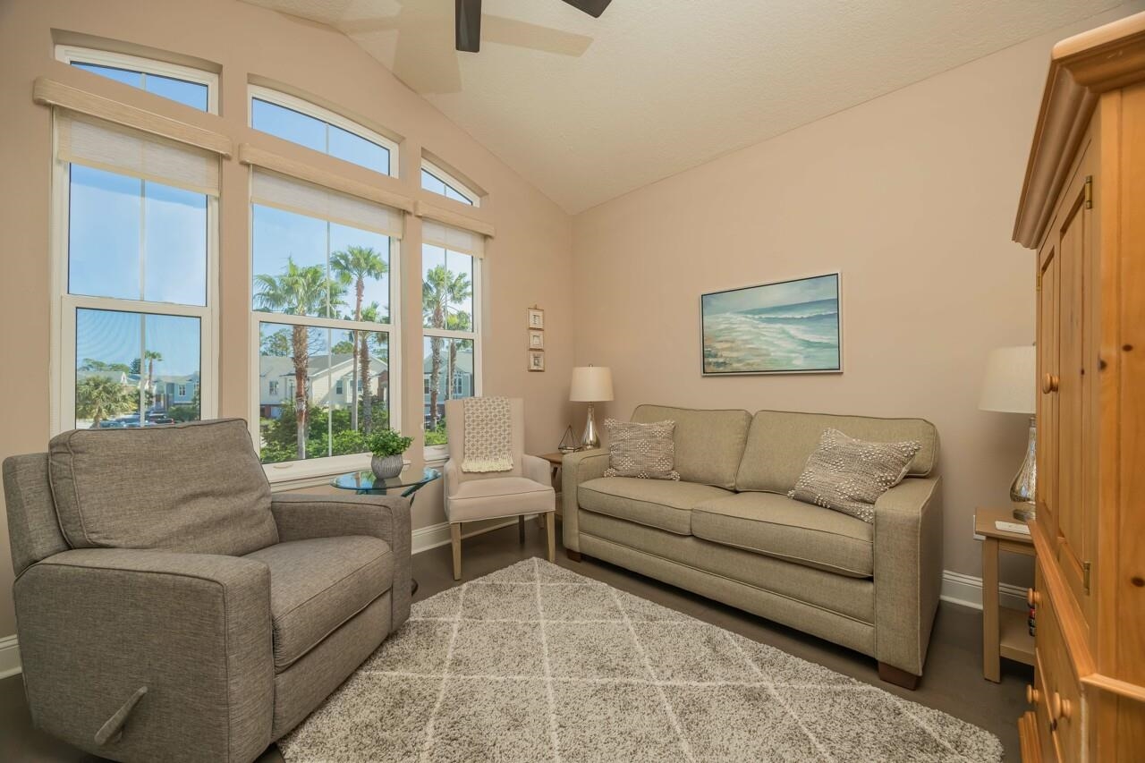 223 Sunset Point St. Augustine, FL 32080 - Photo 17 of 74 a living room with furniture and a large window
