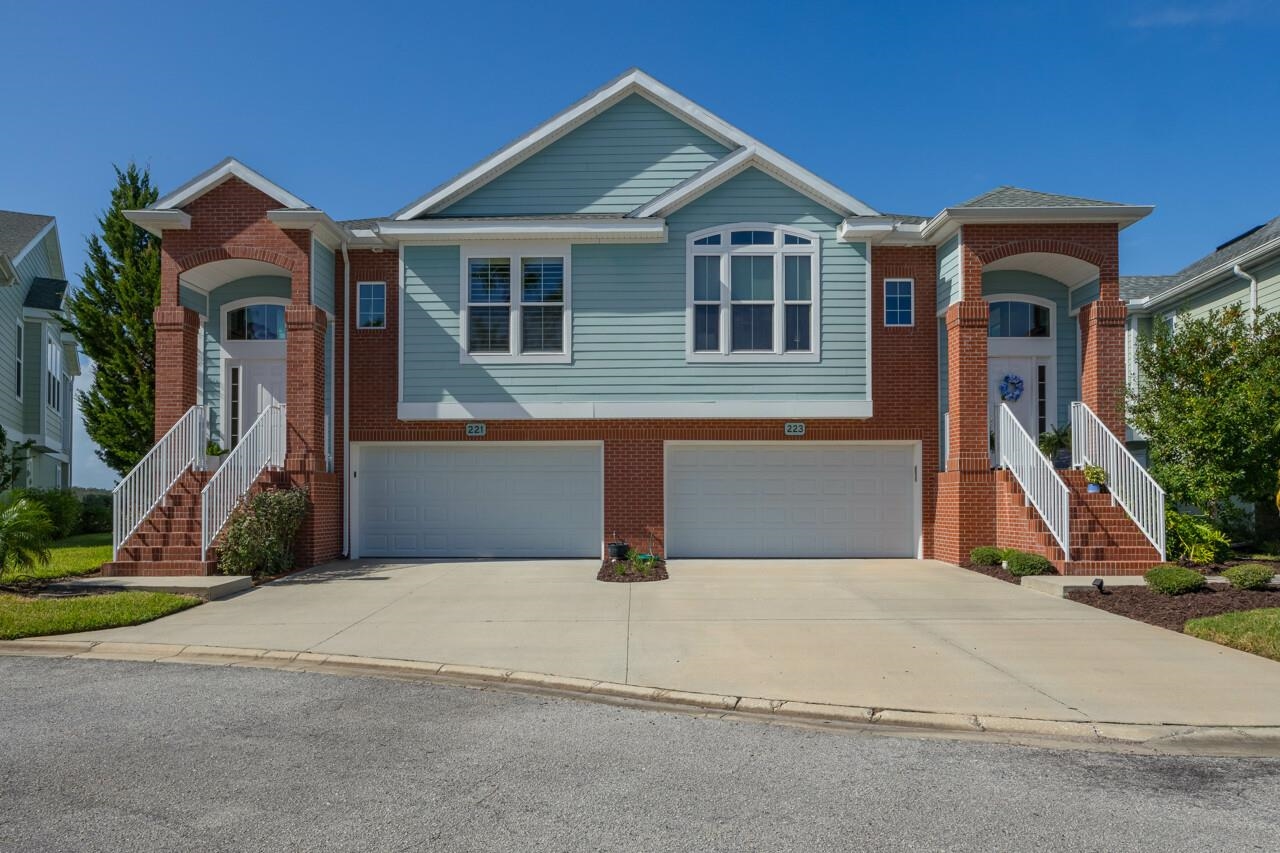 223 Sunset Point St. Augustine, FL 32080 - Photo 25 of 74 a front view of a house with yard