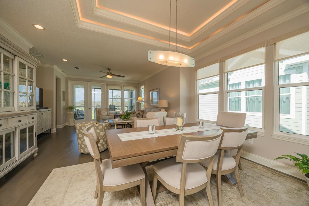 223 Sunset Point St. Augustine, FL 32080 - Photo 9 of 74 a view of a dining room with furniture window and wooden floor