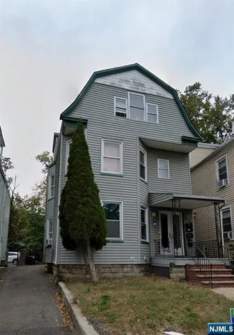 a front view of a house with garage