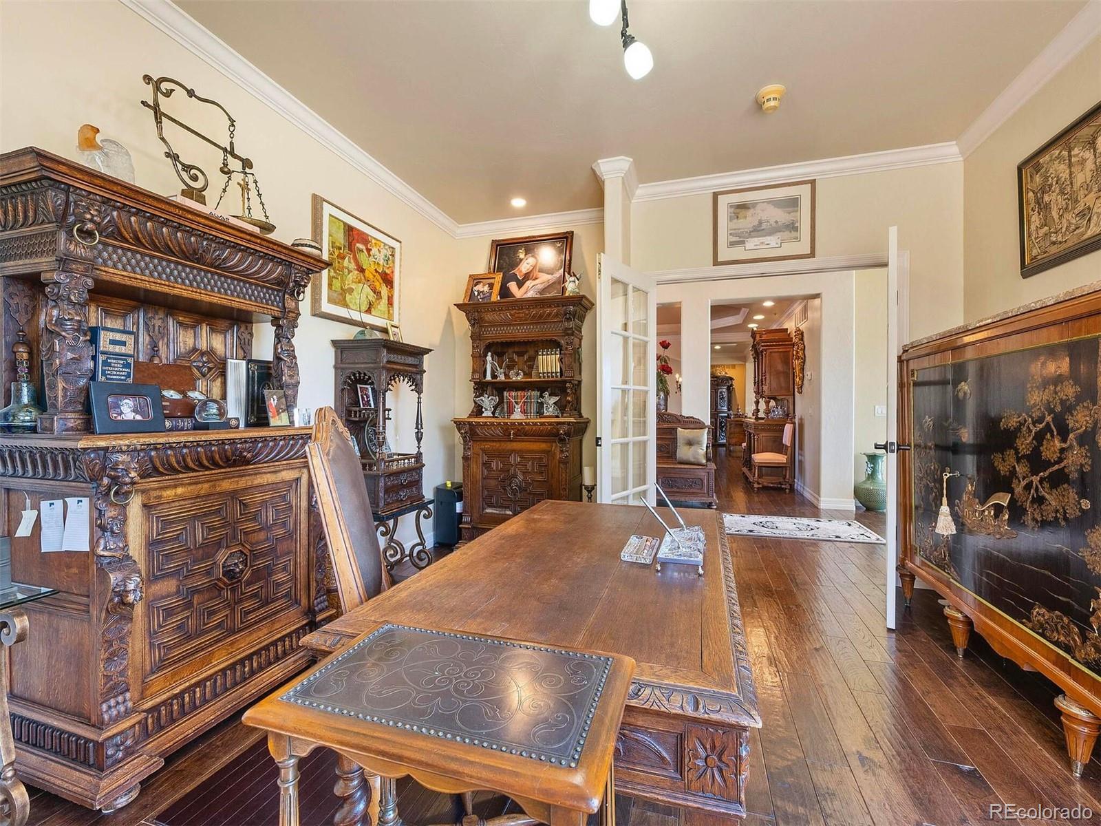 2124 Ridge Plaza Drive Castle Rock, CO 80108 - Photo 13 of 50 a living room with furniture a flat screen tv and a refrigerator