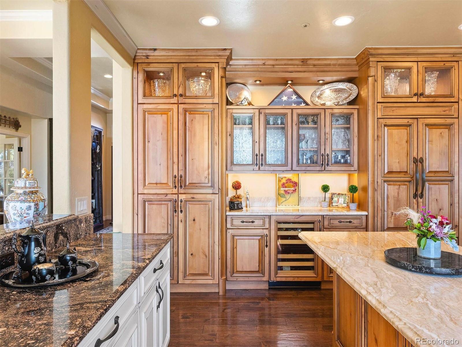 2124 Ridge Plaza Drive Castle Rock, CO 80108 - Photo 17 of 50 a view of a kitchen with stainless steel appliances granite countertop a sink and cabinets