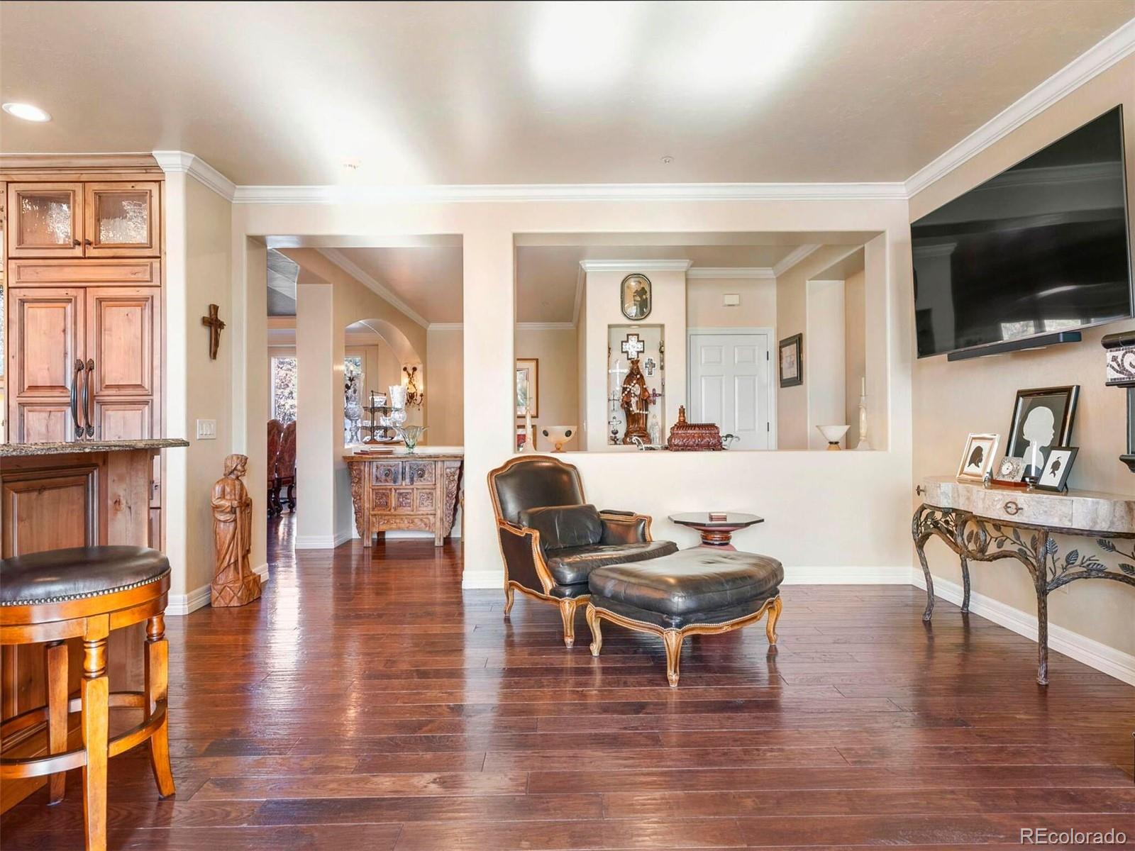 2124 Ridge Plaza Drive Castle Rock, CO 80108 - Photo 22 of 50 a living room with fireplace furniture and a flat screen tv