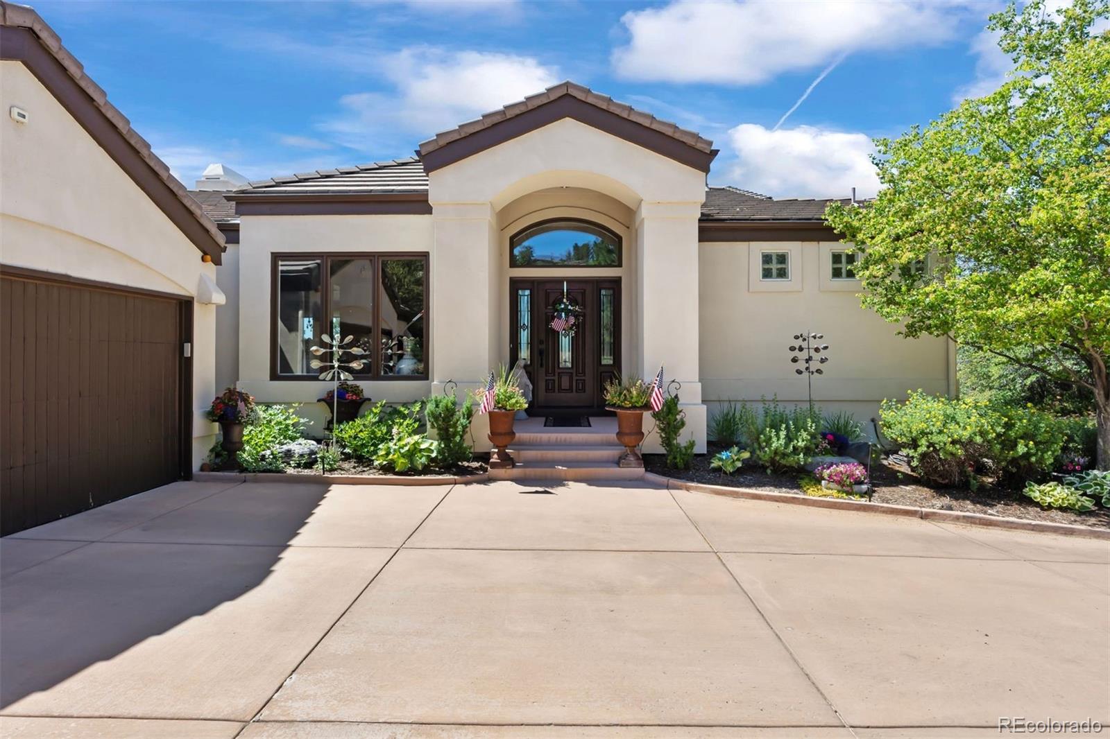 2124 Ridge Plaza Drive Castle Rock, CO 80108 - Photo 3 of 50 a view of a house with potted plants