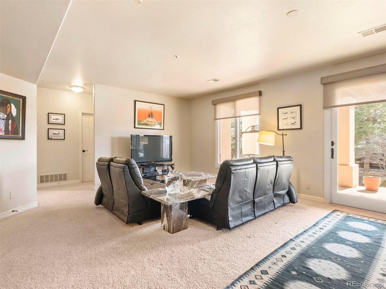 2124 Ridge Plaza Drive Castle Rock, CO 80108 - Photo 31 of 50 a living room with furniture window and a wooden floor