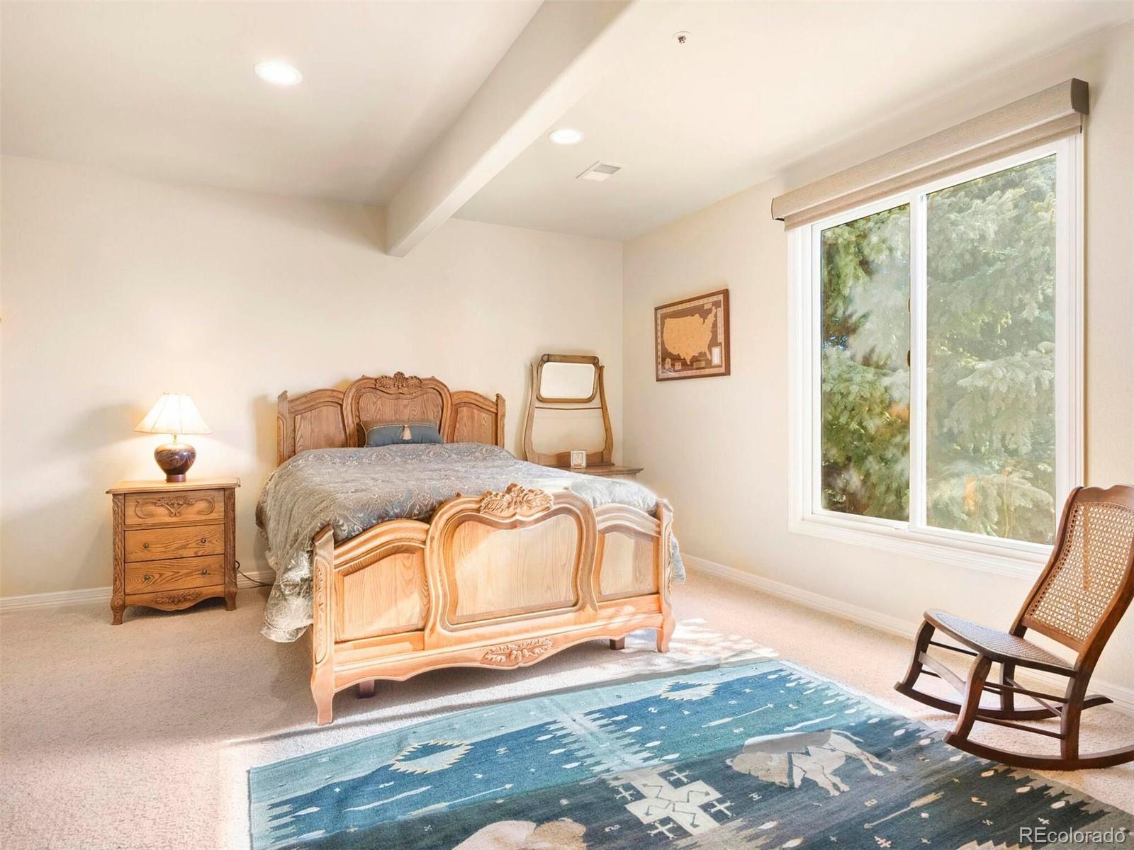 2124 Ridge Plaza Drive Castle Rock, CO 80108 - Photo 34 of 50 a bedroom with furniture and a window