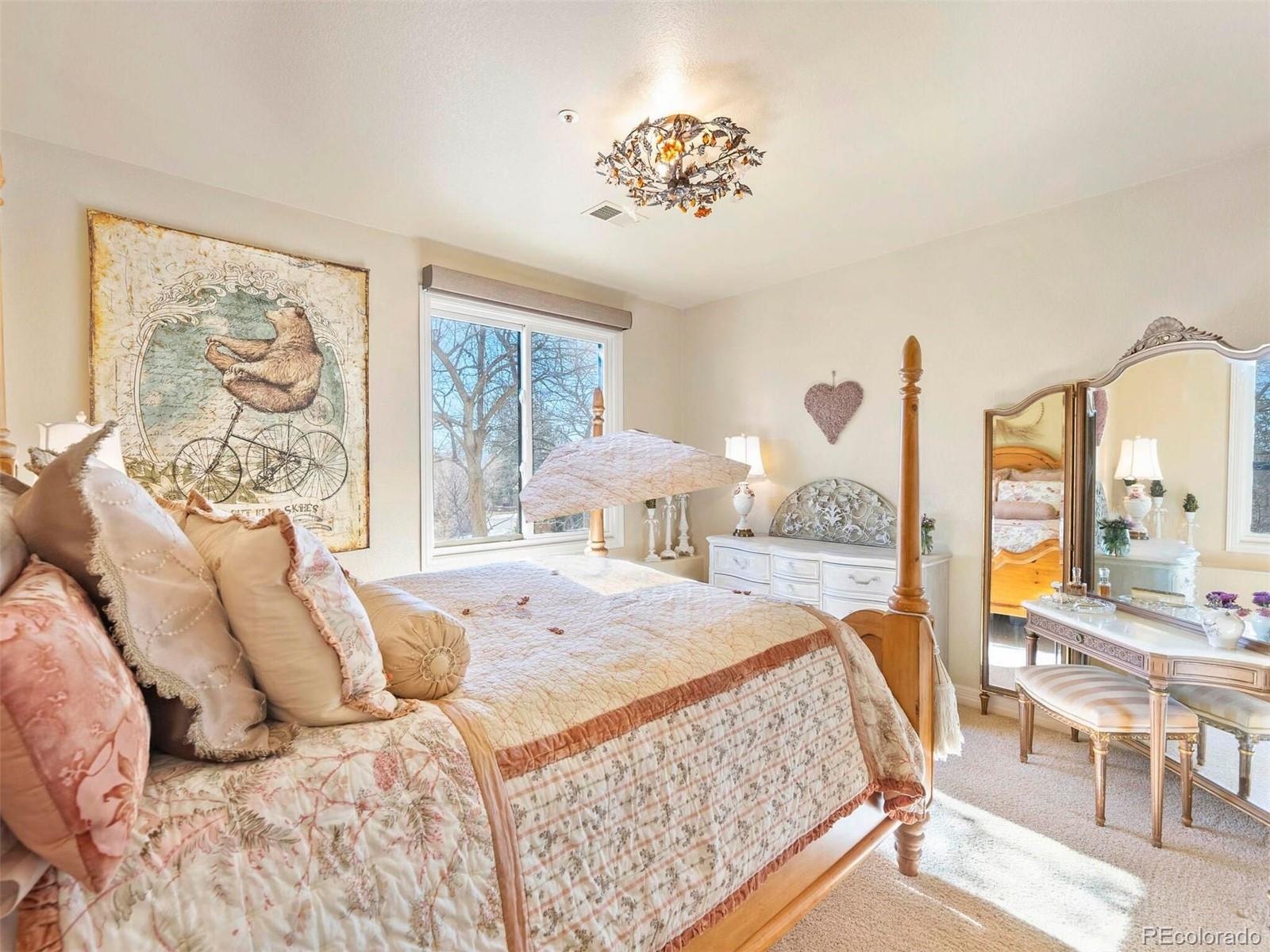 2124 Ridge Plaza Drive Castle Rock, CO 80108 - Photo 36 of 50 a bedroom with a large bed and a large window