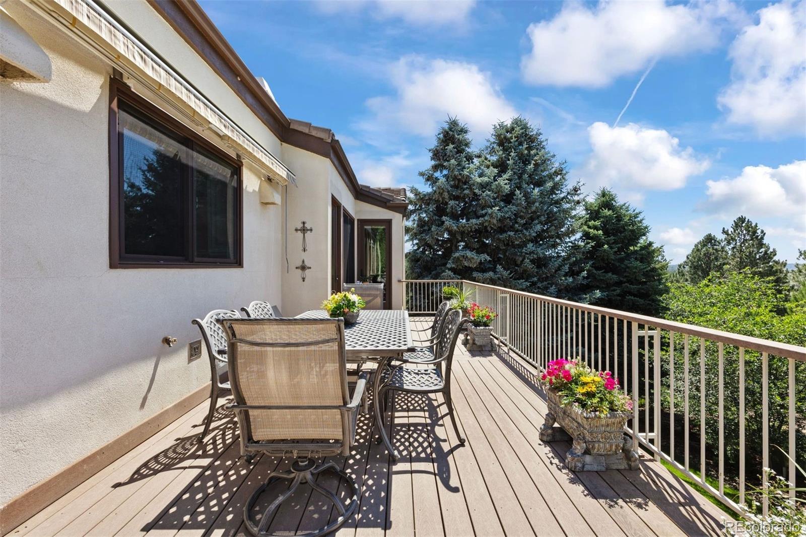 2124 Ridge Plaza Drive Castle Rock, CO 80108 - Photo 41 of 50 a view of deck with furniture and trees