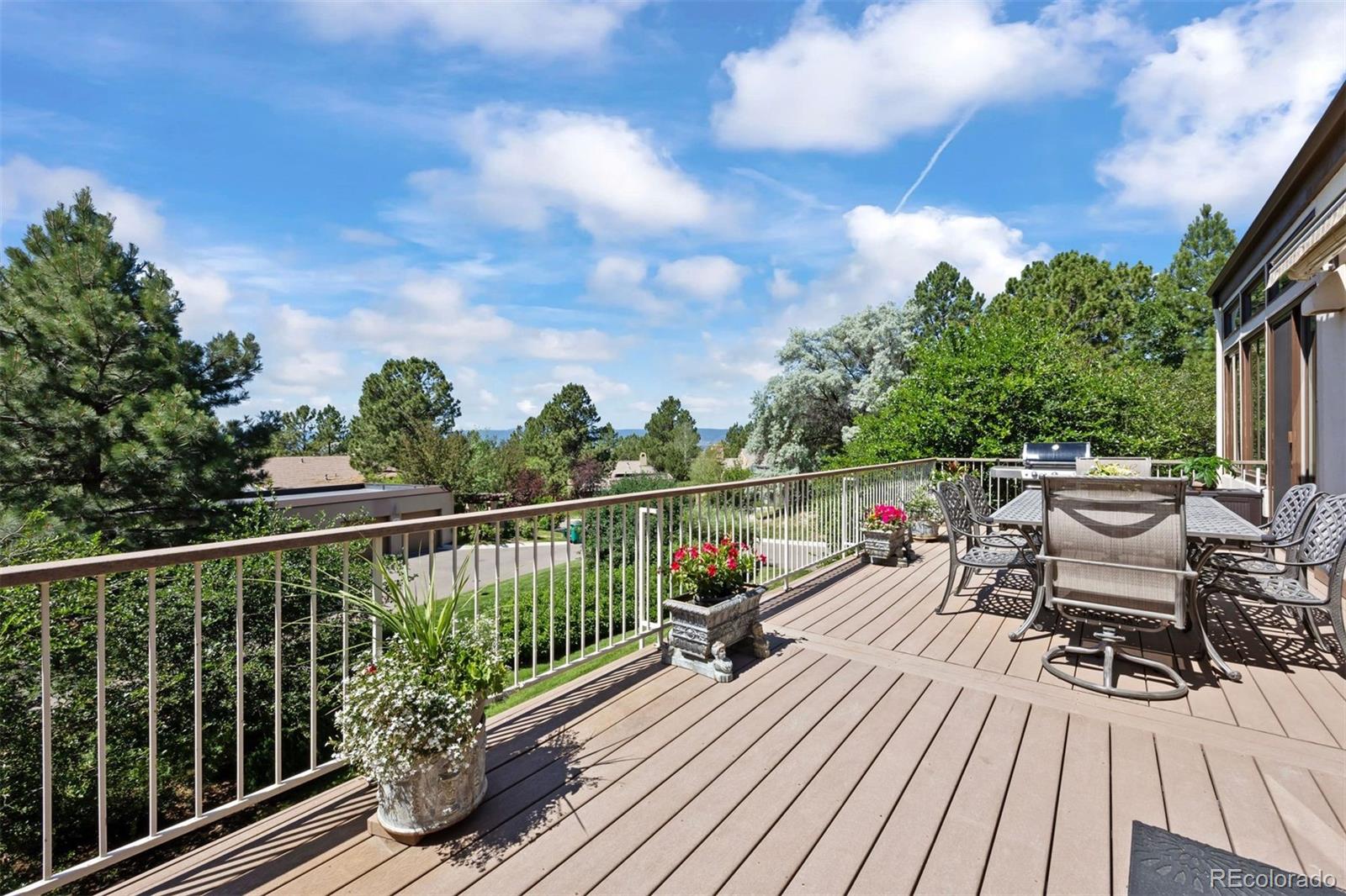 2124 Ridge Plaza Drive Castle Rock, CO 80108 - Photo 42 of 50 a view of a balcony with wooden floor and fence