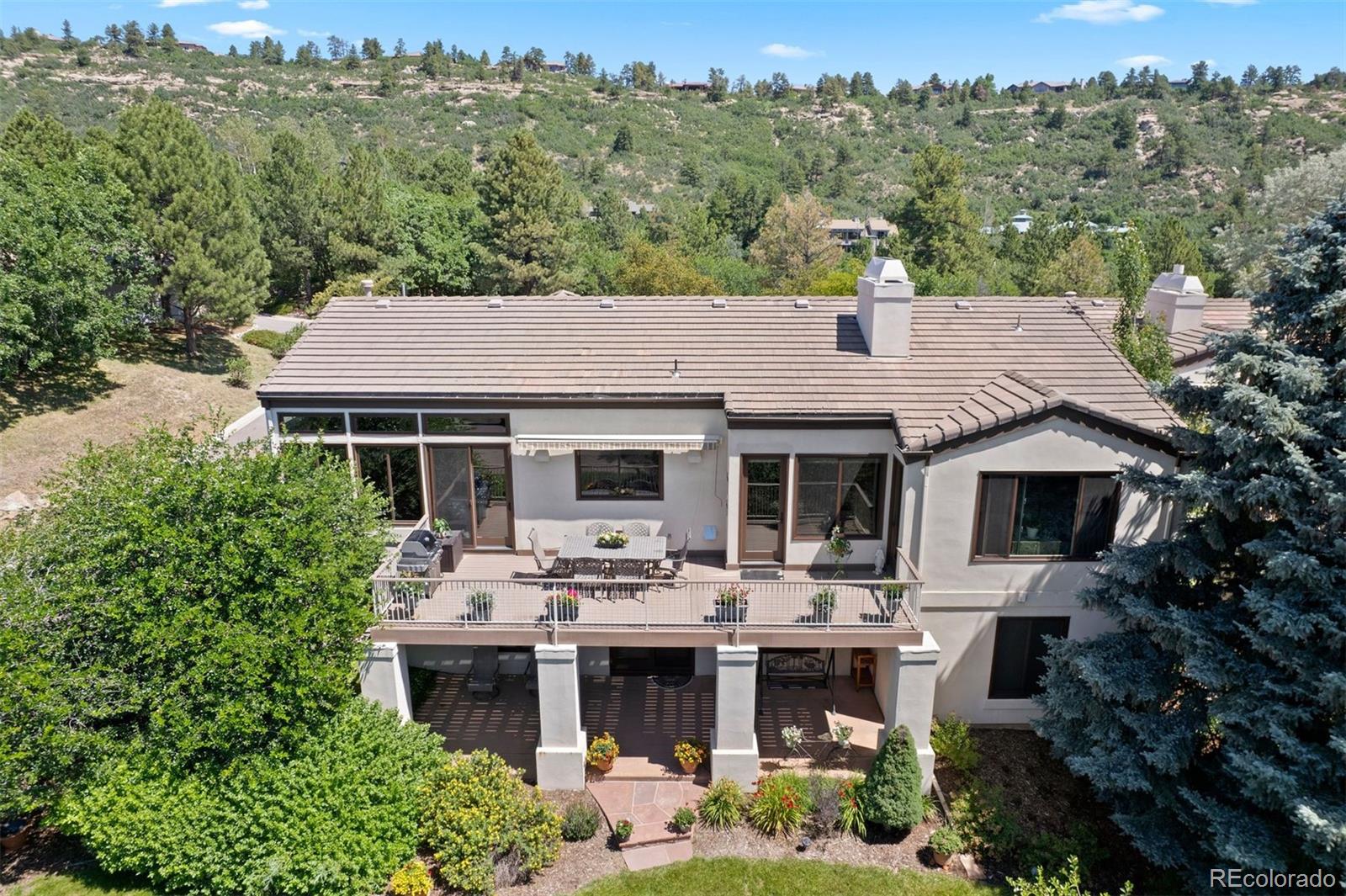 2124 Ridge Plaza Drive Castle Rock, CO 80108 - Photo 47 of 50 a aerial view of a house with a garden and plants