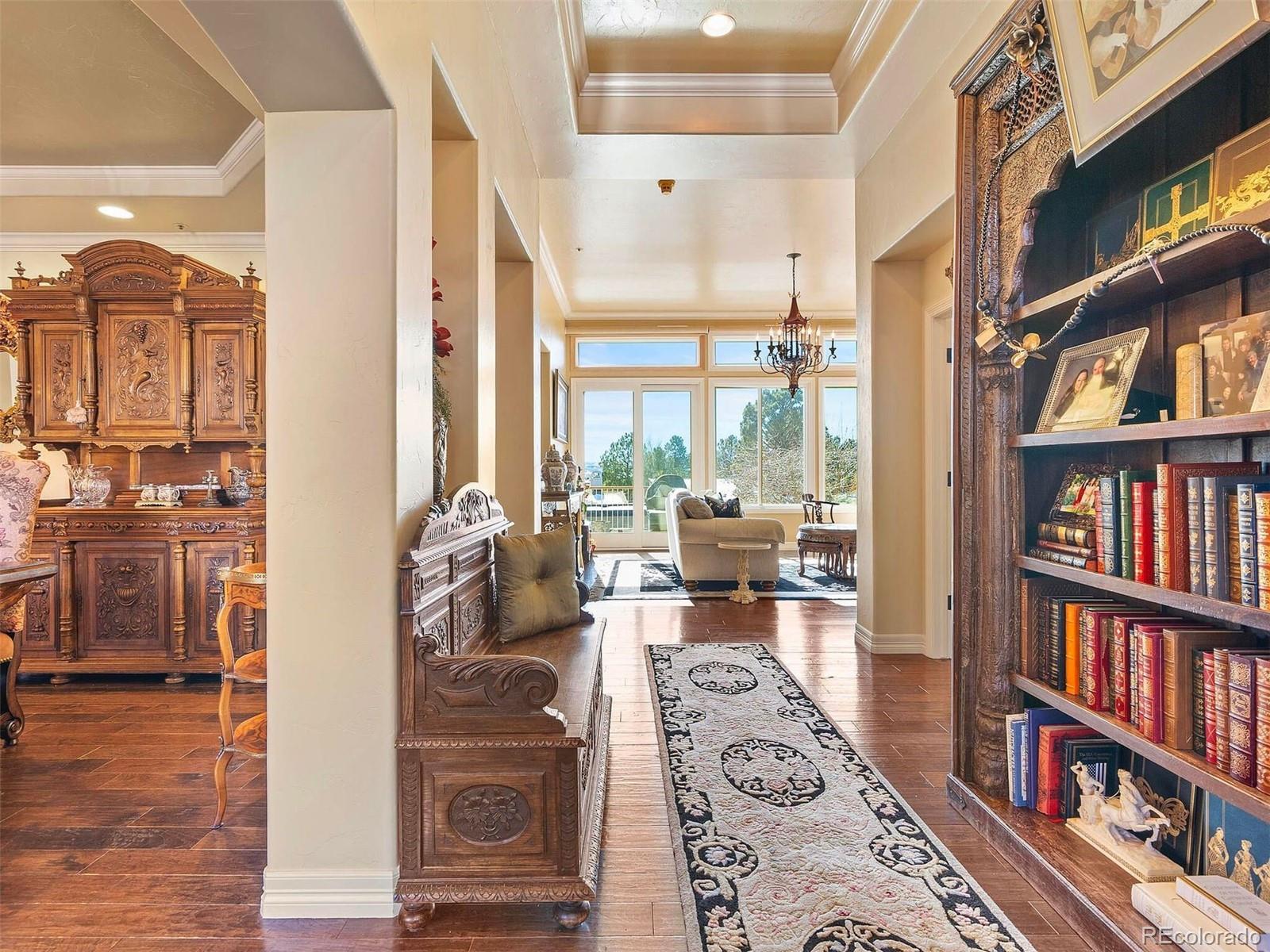 2124 Ridge Plaza Drive Castle Rock, CO 80108 - Photo 5 of 50 a living room with furniture and a book shelf