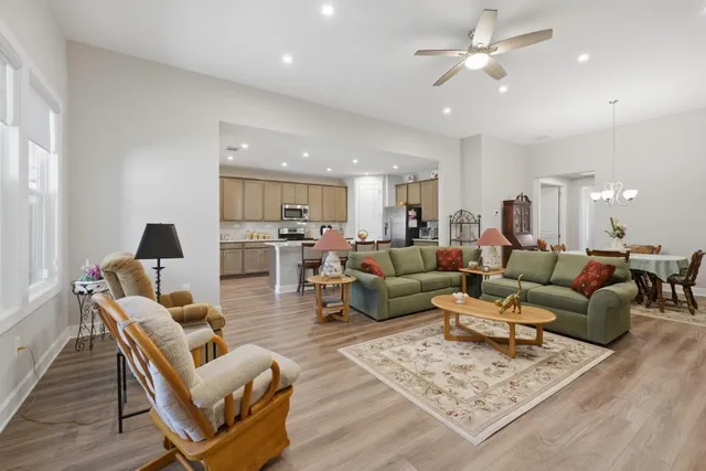 a kitchen with a sink a stove a refrigerator and cabinets