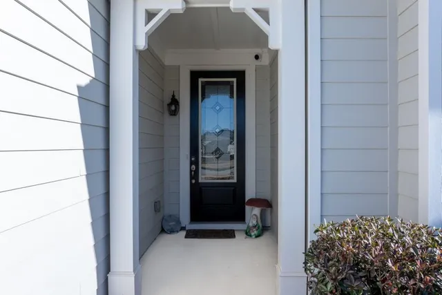 a view of a hallway view with wooden floor and staircase
