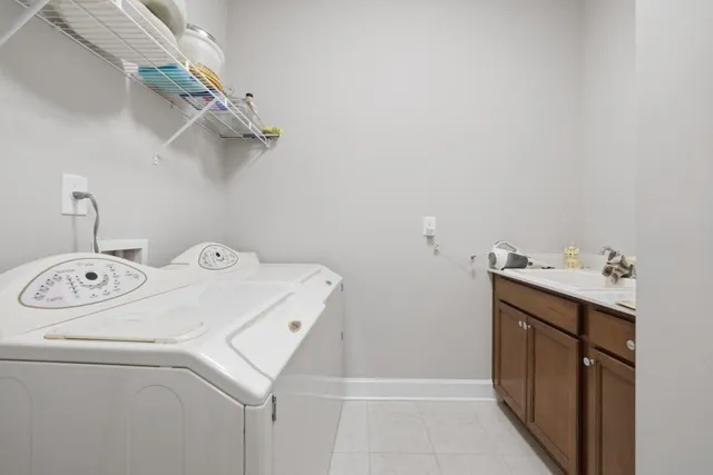 a bathroom with a glass shower door and a bathroom
